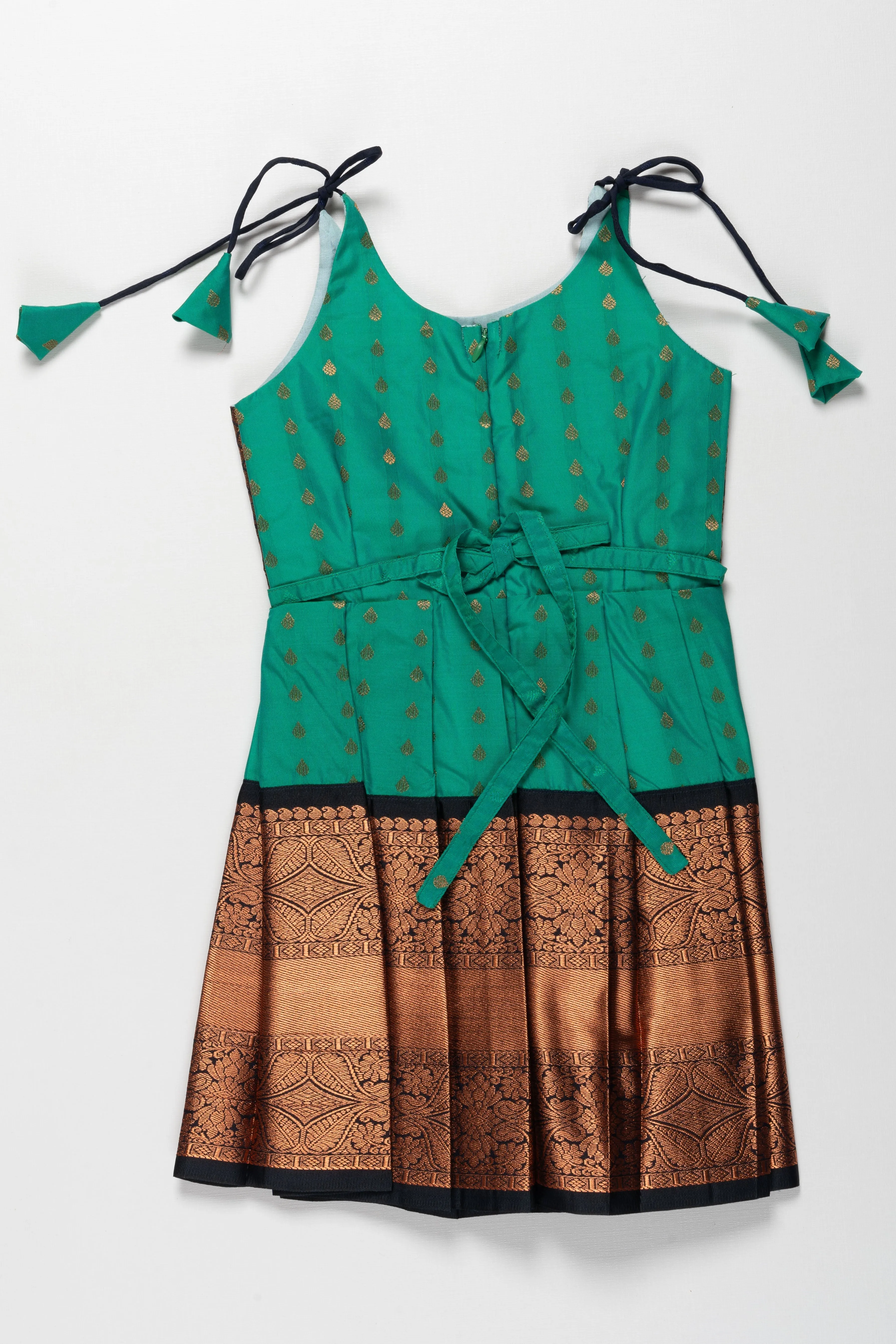 Enchanting Green and Bronze Silk Knot-Tie Frock for Ayush Homam and Noolukettu: A Blend of Tradition